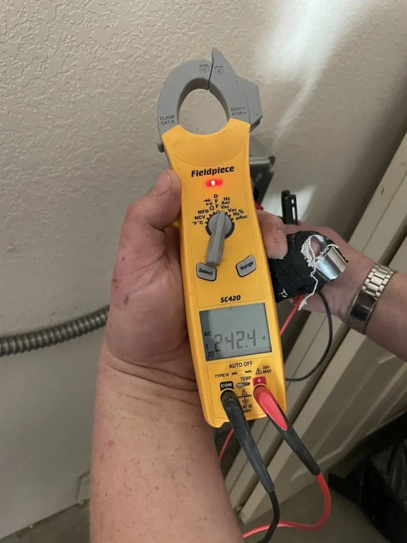 Voltage testing with clamp meter during Circuit Breaker Repair in Aubrey